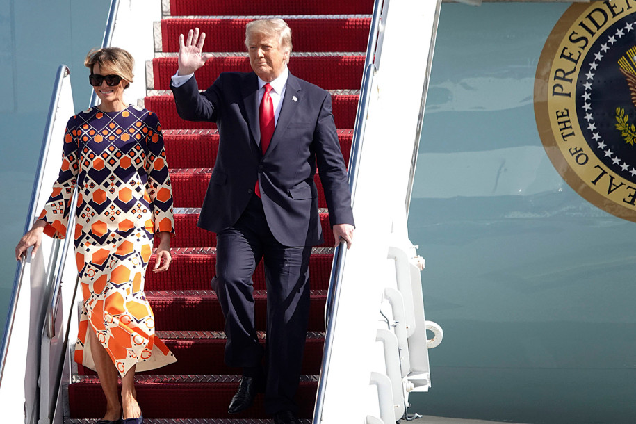 Melania Trump steps out in $3,700 orange dress after landing in Florida ...